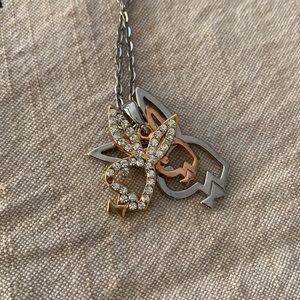 Playboy bunnies necklace.